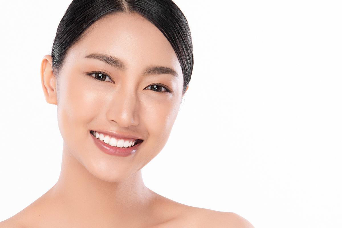 Beautiful smile young woman. White teeth on the master plan. Free space and white background Beautiful smile young woman. White teeth on the master plan. Free space and white background,